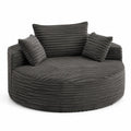 Canapé rond en velours côtelé gris avec coussins