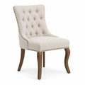 Chaise en tissu beige avec pieds en bois courbés